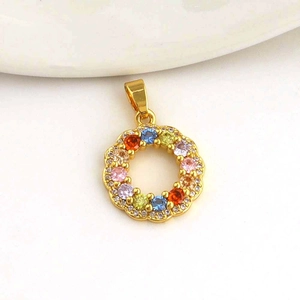 Close-up of a 18k gold-plated wreath pendant with multicolor zircons and micro-pave crystals