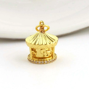 Macro shot of 18k gold-plated rotating carousel pendant with micro-inlaid zircons