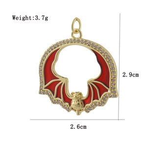 Detailed macro view showing the dimensions of the red enamel bat pendant with CZ stones