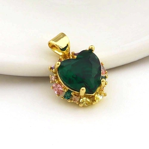 Detailed close-up of heart-shaped green zircon pendant with colorful crystal accents