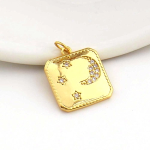 Detail of 18k gold plated square pendant featuring moon, star motifs and zircon stones