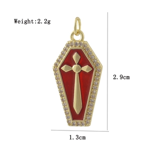 Detail view of 18k gold plated coffin pendant with red enamel and dimension markings