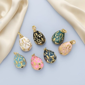 Detailed set of colorful enamel Easter egg pendants with gold vine and zircon inlay