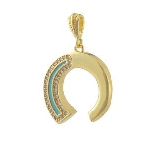 Detail of horseshoe pendant with blue enamel and micro-set crystals in 18k gold plating