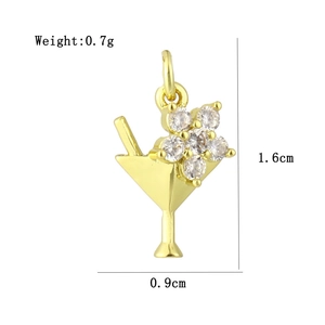 Detailed view of gold cocktail glass pendant with zircon inlay and exact dimensions
