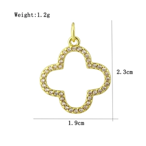 Detail view of a gold clover hollow pendant featuring sparkling zircon pave borders