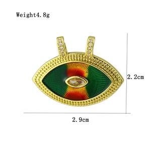 Detailed view of evil eye pendant with tricolor inlay and cubic zirconia pave clasp