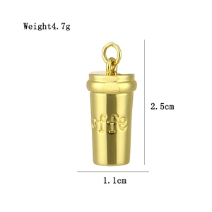 Detailed view of coffee cup pendant in gold with 2.5cm height and 1.1cm width dimensions