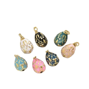 Faberge style enamel egg pendants with gold vine patterns and sparkling crystals
