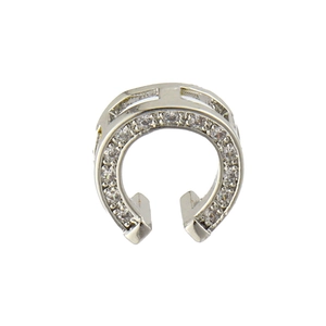 Detailed close-up of a horseshoe-shaped pendant with pavé set zircon stones in silver finish