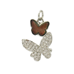 Detailed view of silver butterfly pendant featuring brown enamel and clear zircon stones