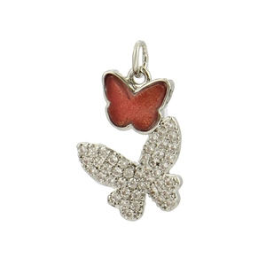 Macro detail of butterfly pendant with red enamel and micro-set cubic zirconia stones