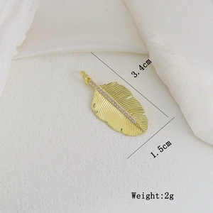 Detail of 3.4cm gold feather pendant with micro-inset zircons and mounting ring