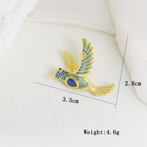 Macro detail of hummingbird brooch with colorful zircons, size 3.5cm by 2.8cm, weight 4.6g