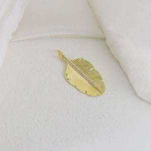 Golden leaf pendant with purple zircon inlay and detailed feather texture for jewelry making