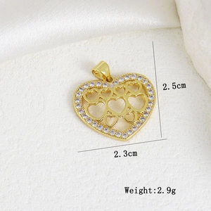 Macro view of gold heart pendant with zircon inlay and detailed size measurements