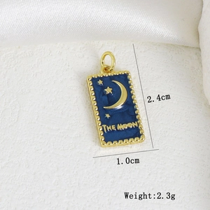 Macro shot of blue enamel tarot moon pendant with 2.4cm height measurements and 2.3g weight