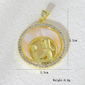 Close-up of mother and child gold pendant with mother of pearl and cubic zirconia stones