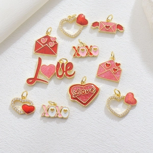 Detail of colorful enamel heart and Love pendants with gold plating and glitter