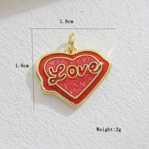 Detail of red heart pendant with Love inscription and 1.8cm by 1.9cm dimensions