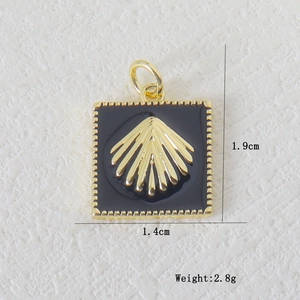 Detail view of 1.4x1.9cm gold shell pendant with black enamel inlay and dimensions