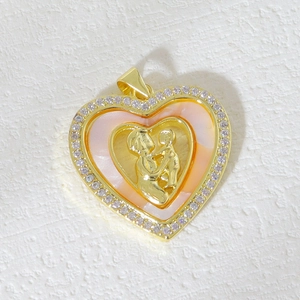 Detail of heart pendant featuring pink mother-of-pearl and mother-child gold relief