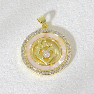 Detailed view of gold mother and child pendant with iridescent shell and zircon pavé