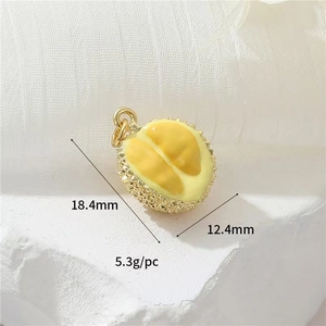 Detailed view of a gold-plated durian pendant with yellow enamel and measurements