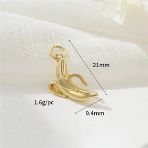Macro detail of gold plated banana pendant with size 21mm x 9.4mm and 1.6g weight