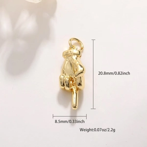 Macro view of gold-plated palm pendant with middle finger design showing precise dimensions