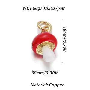 Macro detail of red mushroom pendant in copper with 18k gold plating and white enamel