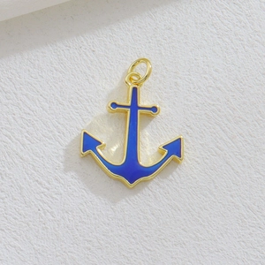 Blue enamel anchor pendant with gold metal trim and open jump ring for DIY jewelry