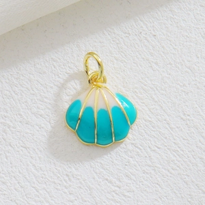 Macro view of gold-plated ocean shell pendant with blue enamel for DIY jewelry