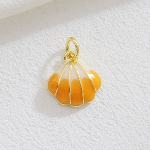Macro detail of a shell pendant with golden trim and gradient enamel finish