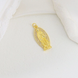 Golden Virgin Mary oval pendant with pink cubic zirconia on white marble silk