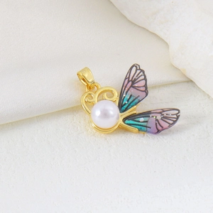 Detailed butterfly pendant with pink gradient wings and a lustrous round white pearl inlay