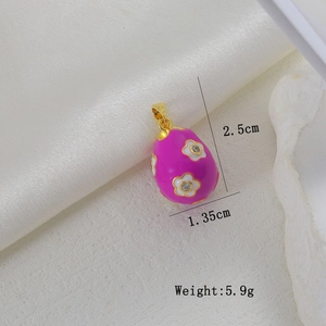 Macro view of pink enamel Easter egg pendant with white floral zircon inlay and dimensions