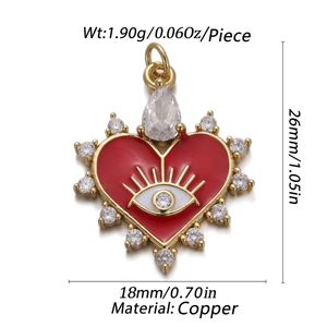 Detail of 26mm heart-shaped copper pendant with red enamel and evil eye motif