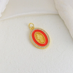 Detailed close-up of a golden oval pendant with red enamel and central portrait relief