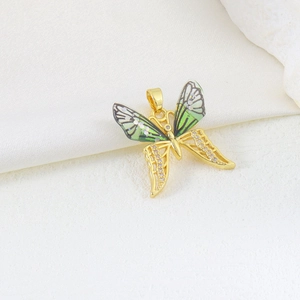 Exquisite gold butterfly pendant with green enamel and sparkling zircon inlay detail