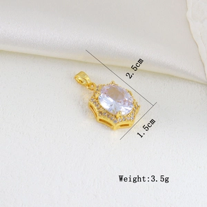 Detail of oval white zircon pendant with gold setting and small crystals on satin