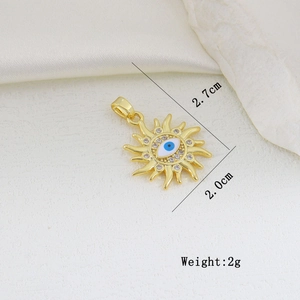 Macro shot of sun-shaped evil eye pendant with dimensions 2.7cm by 2.0cm and weight of 2g