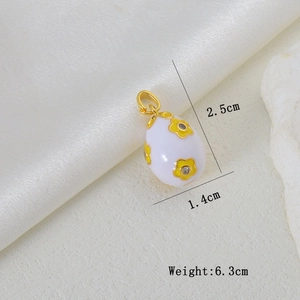 Detailed view of white enamel Easter egg pendant with floral patterns and dimensions