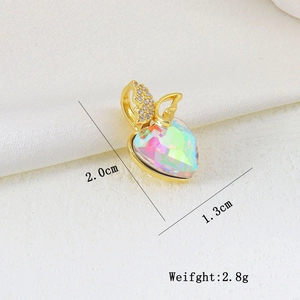 Macro view of a gold heart pendant with colorful crystal and butterfly zircon detail