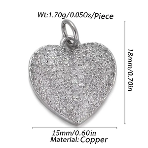 Detailed view of silver heart pendant with white stones and precise measurements
