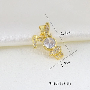 Macro detail of a gold bunny pendant with white cubic zirconia and size dimensions