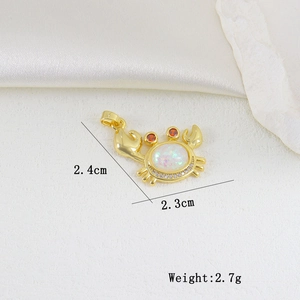 Detailed view of crab pendant with opal stone and measurements 2.4cm by 2.3cm