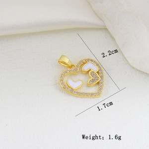 Detail of gold-plated hollow heart pendant with zircons and white enamel accents