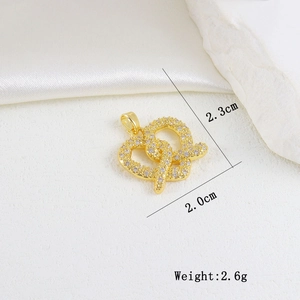 Macro view of gold interwoven hearts pendant with white zircon pavé and dimensions