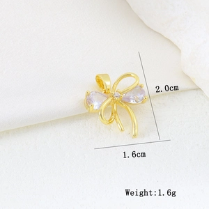 Macro shot of gold butterfly pendant with sparkling zircons and product dimensions